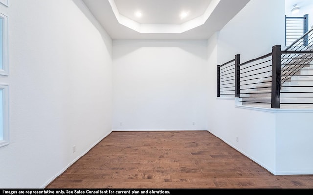 422 Riesling Dr, Alvin, TX 77511 - empty room with wood finished floors, a raised ceiling, baseboards, and recessed lighting