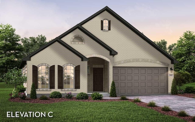 422 Riesling Dr, Alvin, TX 77511 - french country inspired facade with brick siding, driveway, a front lawn, and a garage