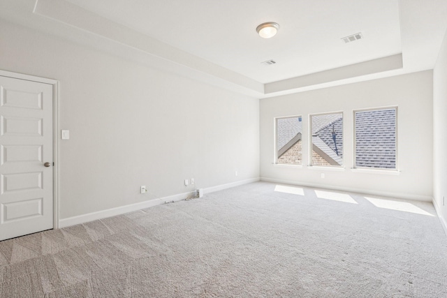 28814 Creekside Bend Dr, Fulshear, TX 77441 - carpeted empty room with a tray ceiling and baseboards