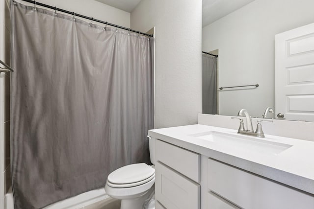 28814 Creekside Bend Dr, Fulshear, TX 77441 - bathroom featuring vanity, toilet, curtained shower, and a textured wall