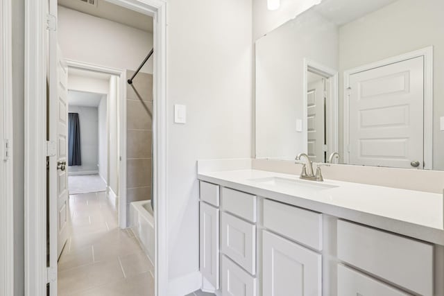 28814 Creekside Bend Dr, Fulshear, TX 77441 - bathroom featuring vanity, tile patterned flooring, tub / shower combination, and baseboards