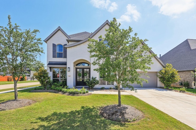 28814 Creekside Bend Dr, Fulshear, TX 77441 - french country inspired facade featuring brick siding, driveway, an attached garage, french doors, and a front lawn