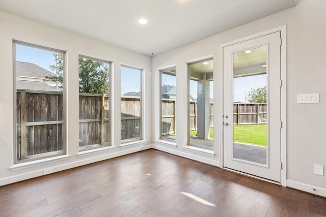 28814 Creekside Bend Dr, Fulshear, TX 77441 - unfurnished sunroom with wood finished floors, recessed lighting, and baseboards