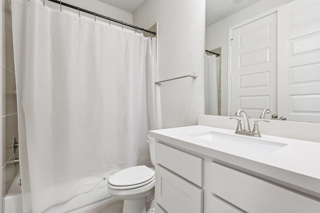 28814 Creekside Bend Dr, Fulshear, TX 77441 - bathroom with vanity, toilet, a textured wall, and shower / bathtub combination with curtain