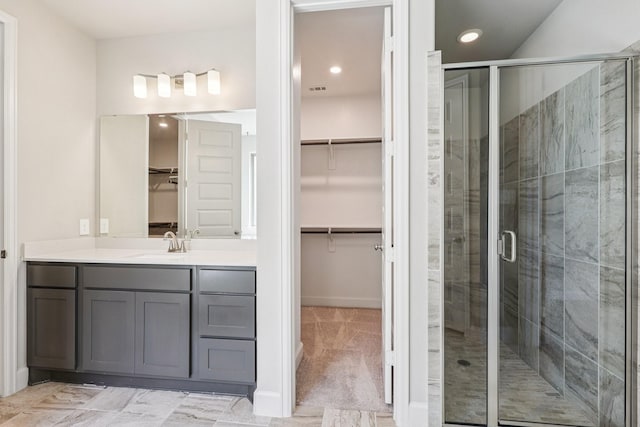 28814 Creekside Bend Dr, Fulshear, TX 77441 - full bathroom with vanity, a walk in closet, a stall shower, recessed lighting, and baseboards