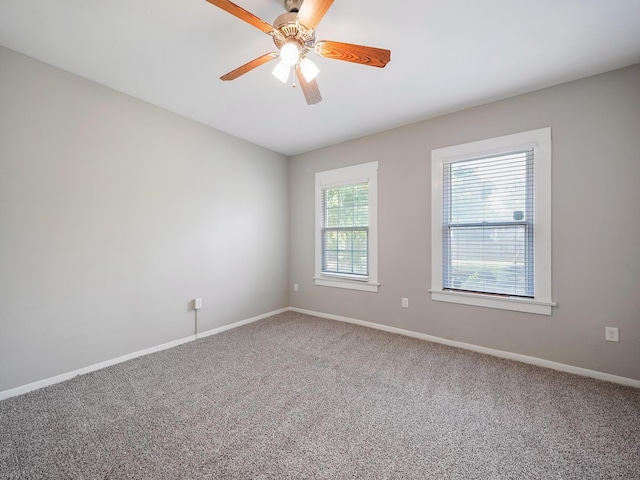 2402 49th St, Galveston, TX 77551 - unfurnished room featuring carpet flooring, baseboards, and ceiling fan