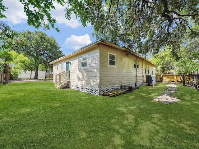 2402 49th St, Galveston, TX 77551 - view of side of property featuring entry steps and cooling unit