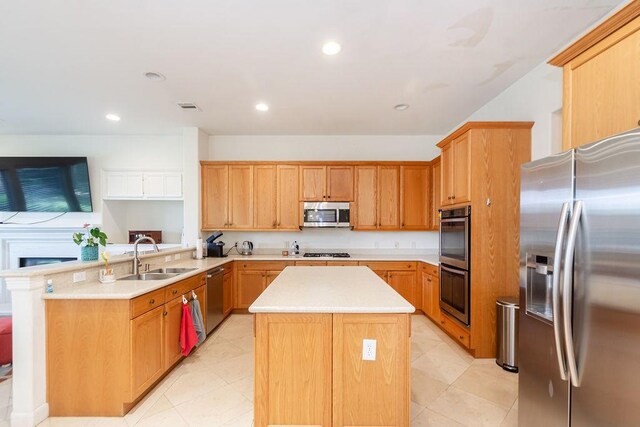 3011 Bonnebridge Way Blvd, Houston, TX 77082 - kitchen featuring stainless steel appliances, a sink, a center island, light countertops, and a peninsula