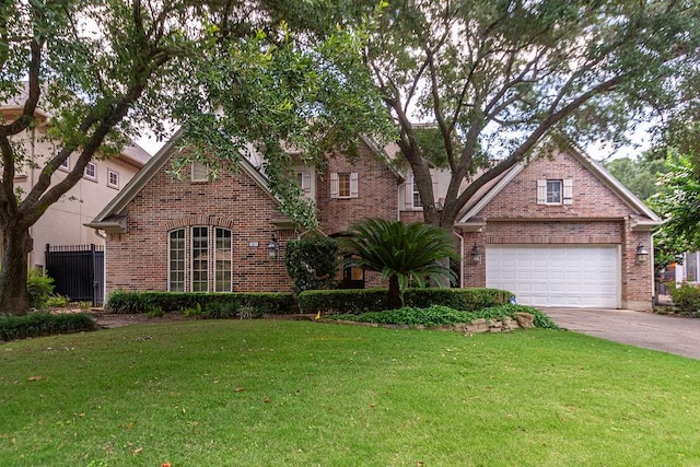 3011 Bonnebridge Way Blvd, Houston, TX 77082 - traditional-style house featuring brick siding, a front yard, a garage, and driveway