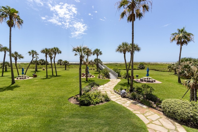 1401 E Beach Dr Unit 903, Galveston, TX 77550 - view of property's community featuring a fire pit and a lawn