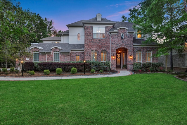 3806 W Benders Landing Blvd, Spring, TX 77386 - view of front facade with a front lawn, brick siding, stucco siding, and a shingled roof
