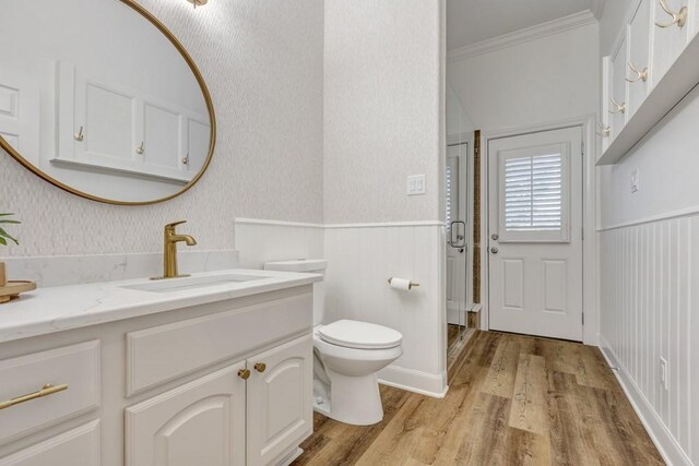 3806 W Benders Landing Blvd, Spring, TX 77386 - bathroom featuring crown molding, wood finished floors, wainscoting, vanity, and toilet