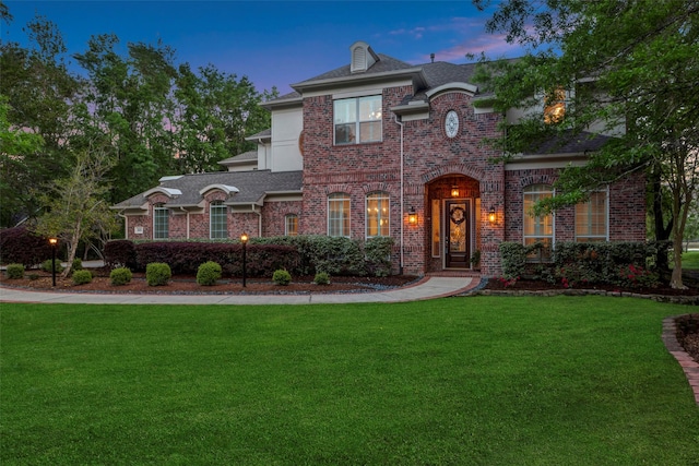 3806 W Benders Landing Blvd, Spring, TX 77386 - view of front of home featuring brick siding, a yard, and roof with shingles
