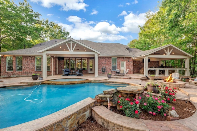 3806 W Benders Landing Blvd, Spring, TX 77386 - swimming pool with an outdoor fire pit, an in-ground hot tub, and a patio
