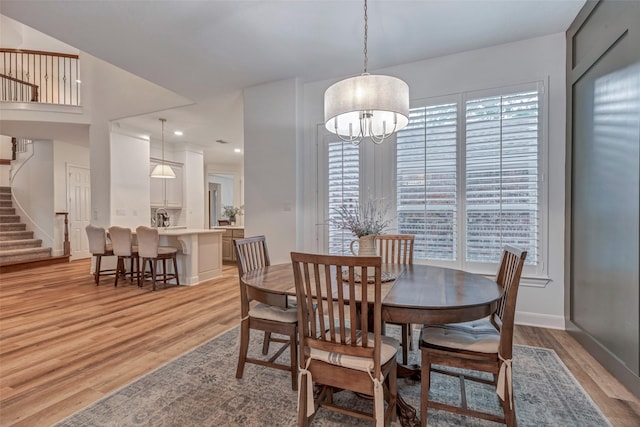 3806 W Benders Landing Blvd, Spring, TX 77386 - dining area featuring light wood-style floors, stairway, a chandelier, baseboards, and recessed lighting