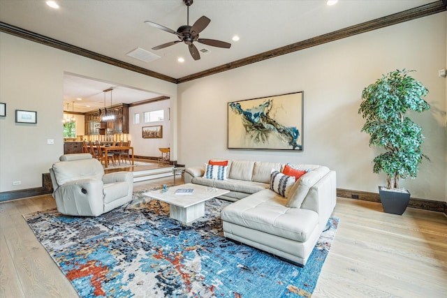 6619 Minola St, Houston, TX 77007 - living room featuring wood finished floors, a ceiling fan, recessed lighting, ornamental molding, and baseboards