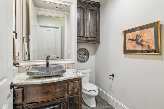 6619 Minola St, Houston, TX 77007 - half bathroom with toilet, vanity, and baseboards