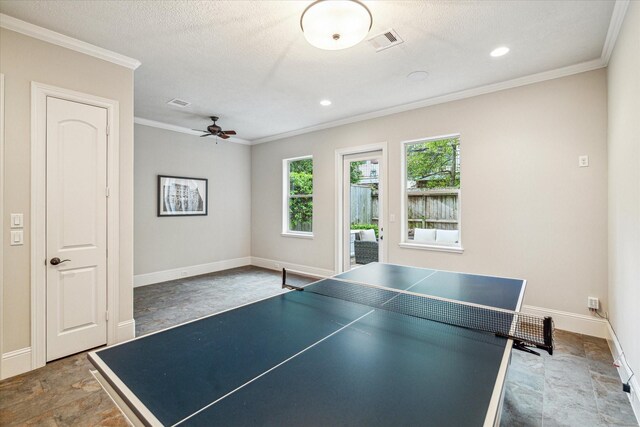6619 Minola St, Houston, TX 77007 - playroom with ceiling fan, ornamental molding, baseboards, stone finish flooring, and recessed lighting