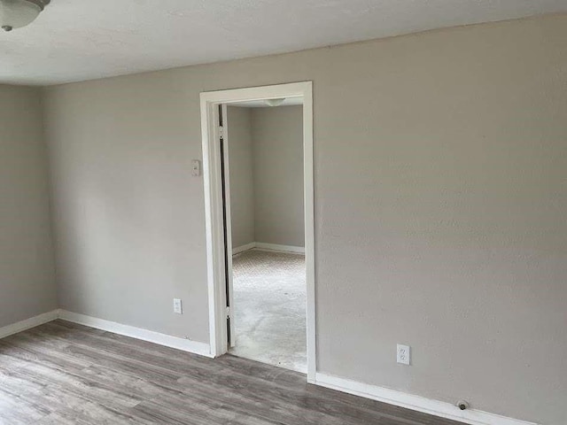 805 E Calhoun St, El Campo, TX 77437 - unfurnished room with wood finished floors and baseboards