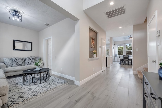 9303 Filaree Ridge Ln, Houston, TX 77089 - corridor featuring baseboards, light wood-type flooring, and recessed lighting