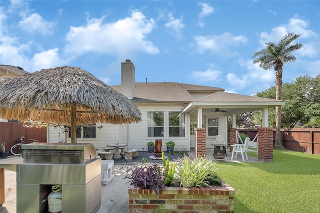 9303 Filaree Ridge Ln, Houston, TX 77089 - back of house with a patio area, a ceiling fan, and a chimney