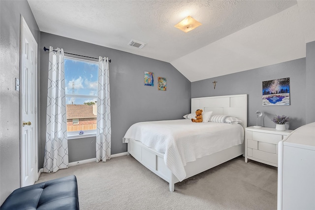 9303 Filaree Ridge Ln, Houston, TX 77089 - bedroom featuring light colored carpet, a textured ceiling, vaulted ceiling, and baseboards