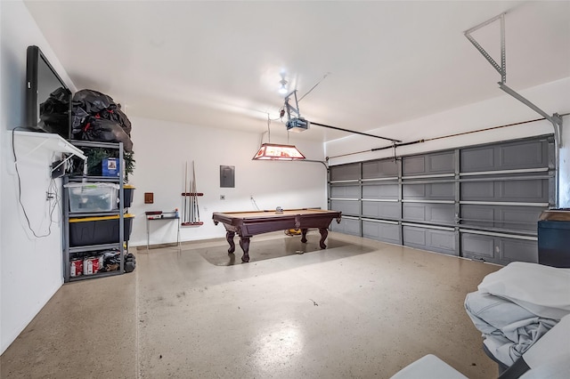 9303 Filaree Ridge Ln, Houston, TX 77089 - garage featuring a garage door opener and electric panel