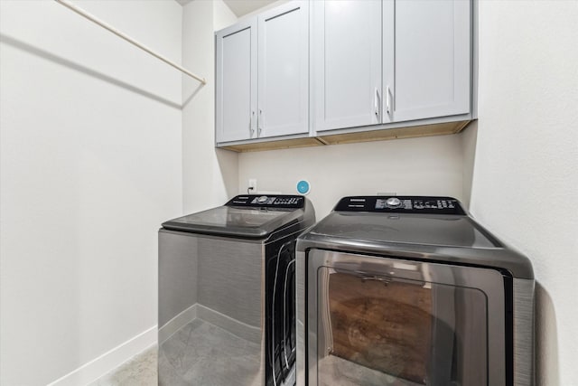 823 Mansfield St Unit E, Houston, TX 77091 - washroom with cabinet space, washer and dryer, and baseboards