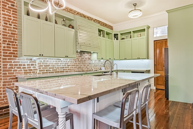 1805 Market St, Galveston, TX 77550 - kitchen with open shelves, a sink, dark wood-type flooring, green cabinetry, and freestanding refrigerator