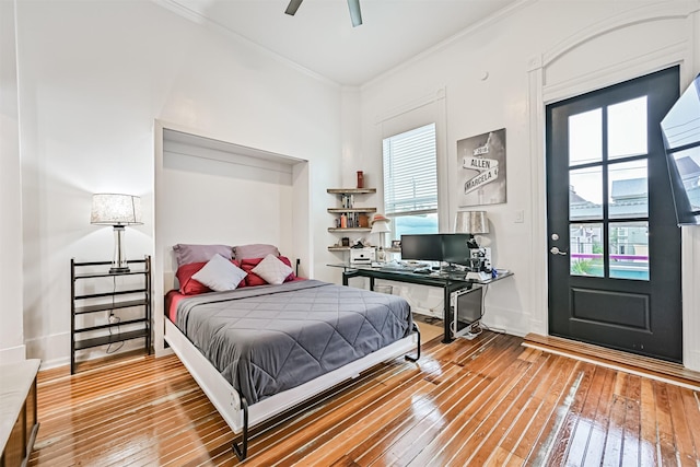 1805 Market St, Galveston, TX 77550 - bedroom with hardwood / wood-style flooring, multiple windows, ornamental molding, and baseboards