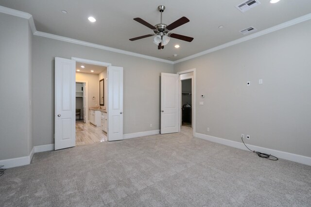 9642 Fannin Sta W, Houston, TX 77045 - unfurnished bedroom featuring light colored carpet, crown molding, baseboards, recessed lighting, and connected bathroom