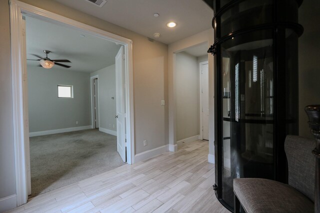 9642 Fannin Sta W, Houston, TX 77045 - hallway featuring baseboards, light wood finished floors, and recessed lighting