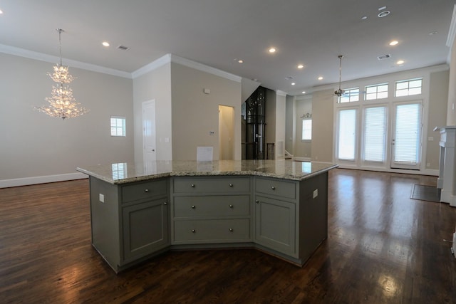 9642 Fannin Sta W, Houston, TX 77045 - kitchen with dark wood-type flooring, crown molding, healthy amount of natural light, a chandelier, and open floor plan