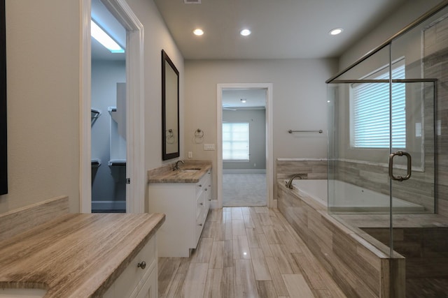9642 Fannin Sta W, Houston, TX 77045 - full bath with vanity, a garden tub, a stall shower, and recessed lighting