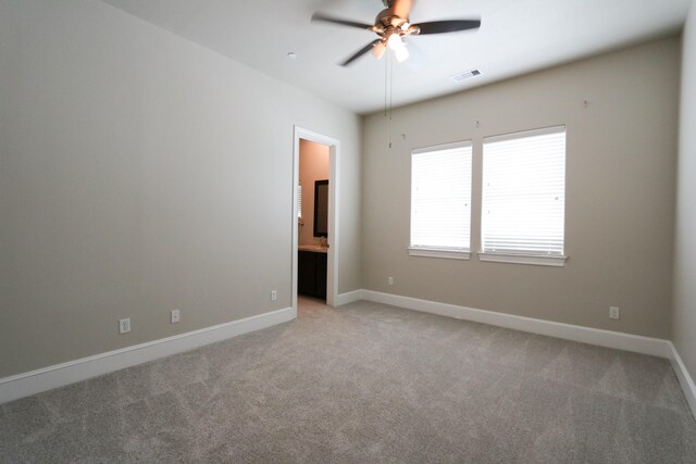 9642 Fannin Sta W, Houston, TX 77045 - spare room with a ceiling fan, light colored carpet, and baseboards