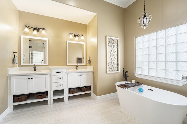 641 Hartman St, Houston, TX 77007 - bathroom with double vanity, a soaking tub, baseboards, tiled shower, and plenty of natural light