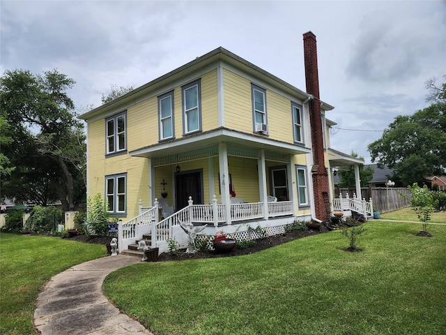 1017 Water St, Navasota, TX 77868 - view of front of home featuring covered porch, a chimney, a front lawn, and cooling unit