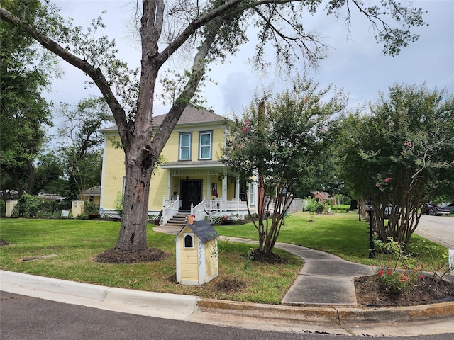 1017 Water St, Navasota, TX 77868 - view of front facade with covered porch and a front yard