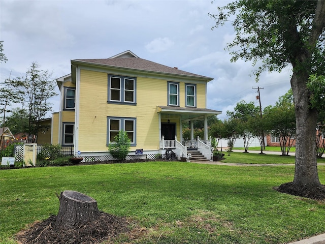 1017 Water St, Navasota, TX 77868 - rear view of property with covered porch and a yard