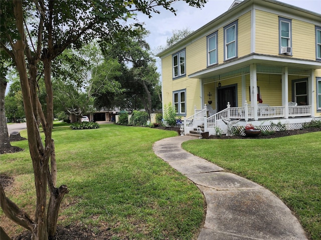 1017 Water St, Navasota, TX 77868 - view of front of home with covered porch, a front yard, and cooling unit