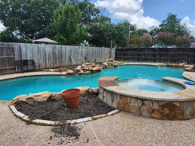 1017 Water St, Navasota, TX 77868 - view of pool featuring a pool with connected hot tub and a fenced backyard
