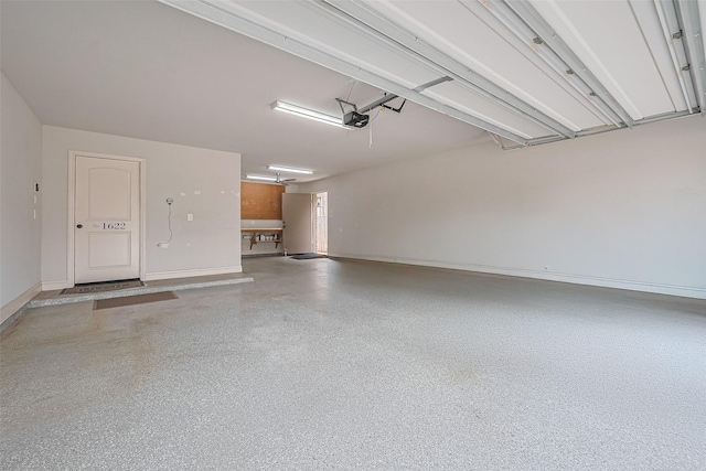 1622 Quail Ridge Dr, Katy, TX 77493 - garage with a garage door opener and baseboards