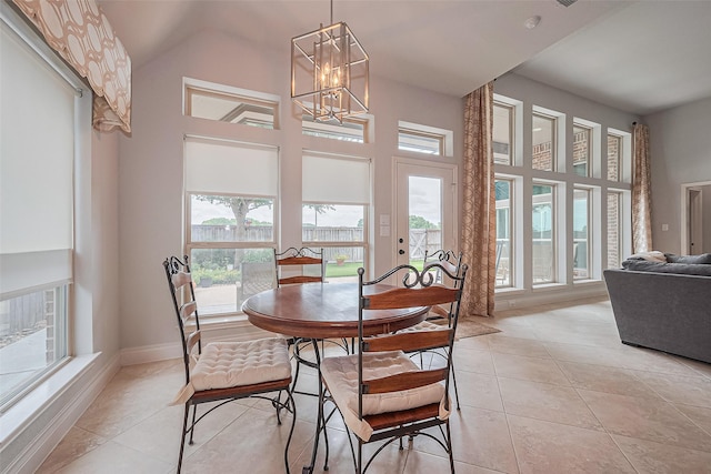 1622 Quail Ridge Dr, Katy, TX 77493 - dining space featuring healthy amount of natural light, a chandelier, light tile patterned flooring, and a high ceiling