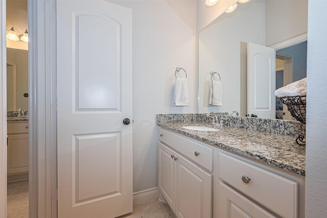 1622 Quail Ridge Dr, Katy, TX 77493 - bathroom featuring vanity and baseboards