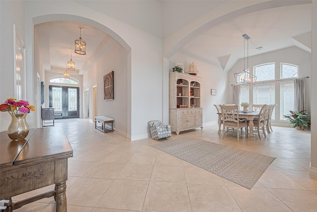 1622 Quail Ridge Dr, Katy, TX 77493 - entryway with a chandelier, healthy amount of natural light, light tile patterned floors, french doors, and lofted ceiling