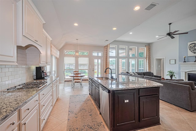 1622 Quail Ridge Dr, Katy, TX 77493 - kitchen featuring a sink, appliances with stainless steel finishes, plenty of natural light, white cabinets, and recessed lighting