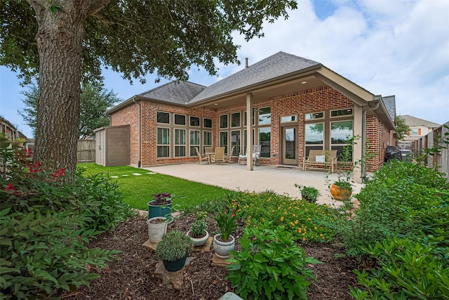 1622 Quail Ridge Dr, Katy, TX 77493 - back of property with brick siding, a patio area, and roof with shingles
