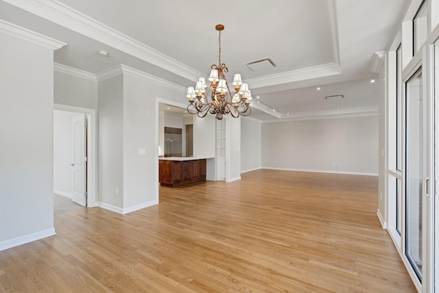 511 S Post Oak Ln Unit 2B, Houston, TX 77056 - empty room featuring a chandelier, light wood finished floors, crown molding, and baseboards