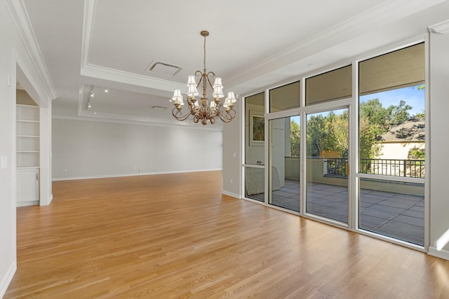 511 S Post Oak Ln Unit 2B, Houston, TX 77056 - empty room with ornamental molding, light wood finished floors, a chandelier, and baseboards