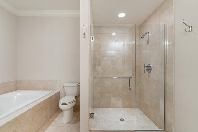 511 S Post Oak Ln Unit 2B, Houston, TX 77056 - bathroom with toilet, a garden tub, a stall shower, crown molding, and tile patterned floors